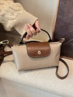 Retro fashion versatile women's bags, one-shoulder, cross-body hand-carrying, high-end nylon dumpling bags